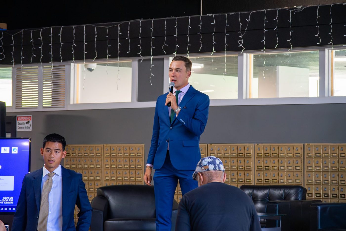 Galien Del Vecchio on stage at a Menlo College event